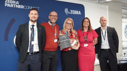 Image of the TEC-RFID and Zebra teams celebrating TEC-RFID being awarded the Location and Tracking Specialist of the Year award